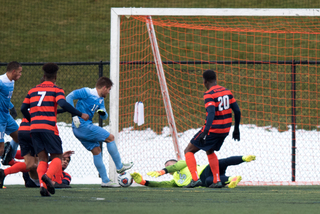 Hilpert dives on the ground as the Tar Heels pressure inside the box.